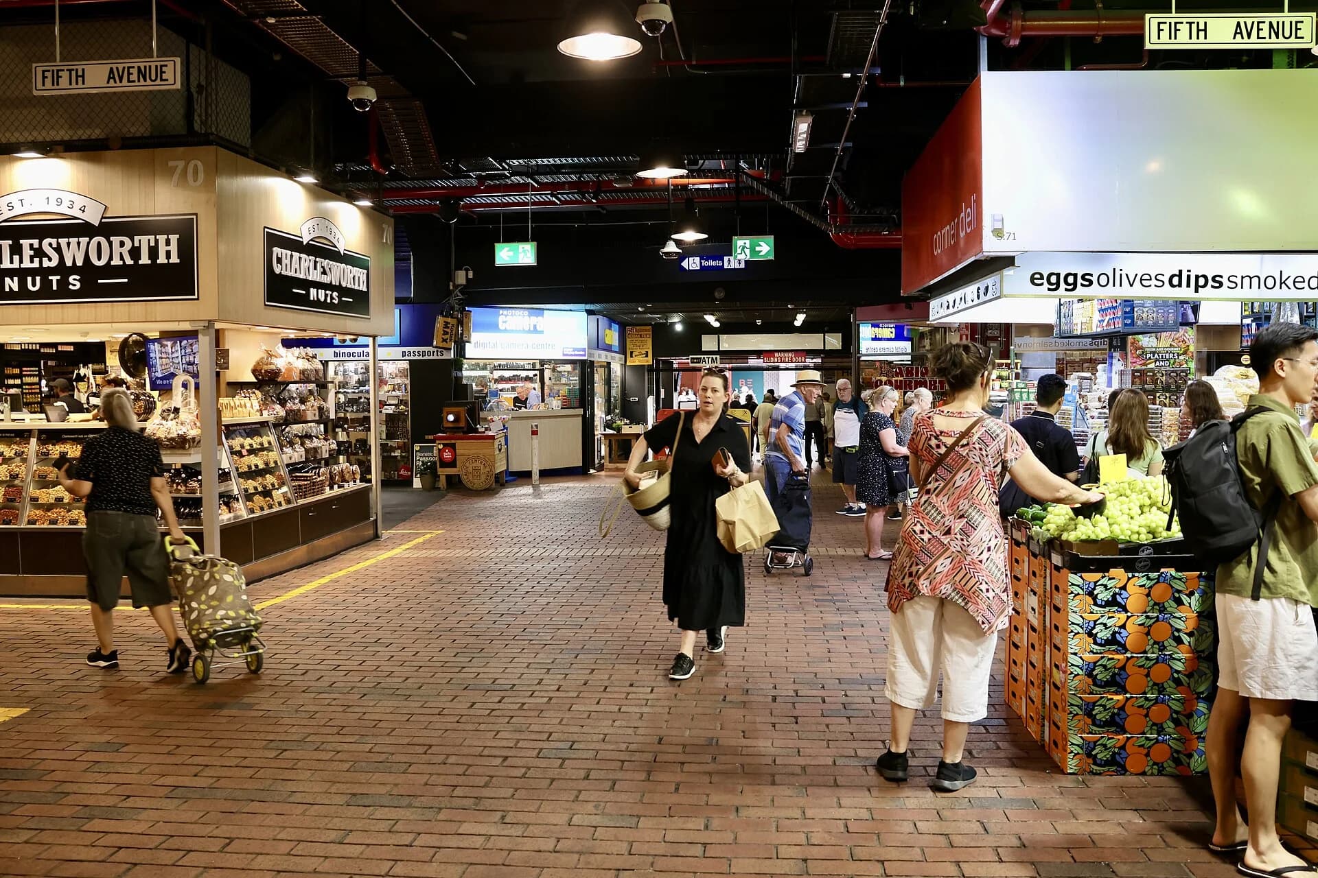 Shoppers and produce stalls inside Adelaide Central Market