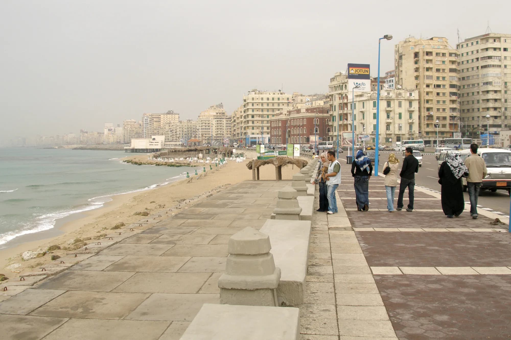 Alexandria Corniche curving along the Mediterranean with dense city buildings
