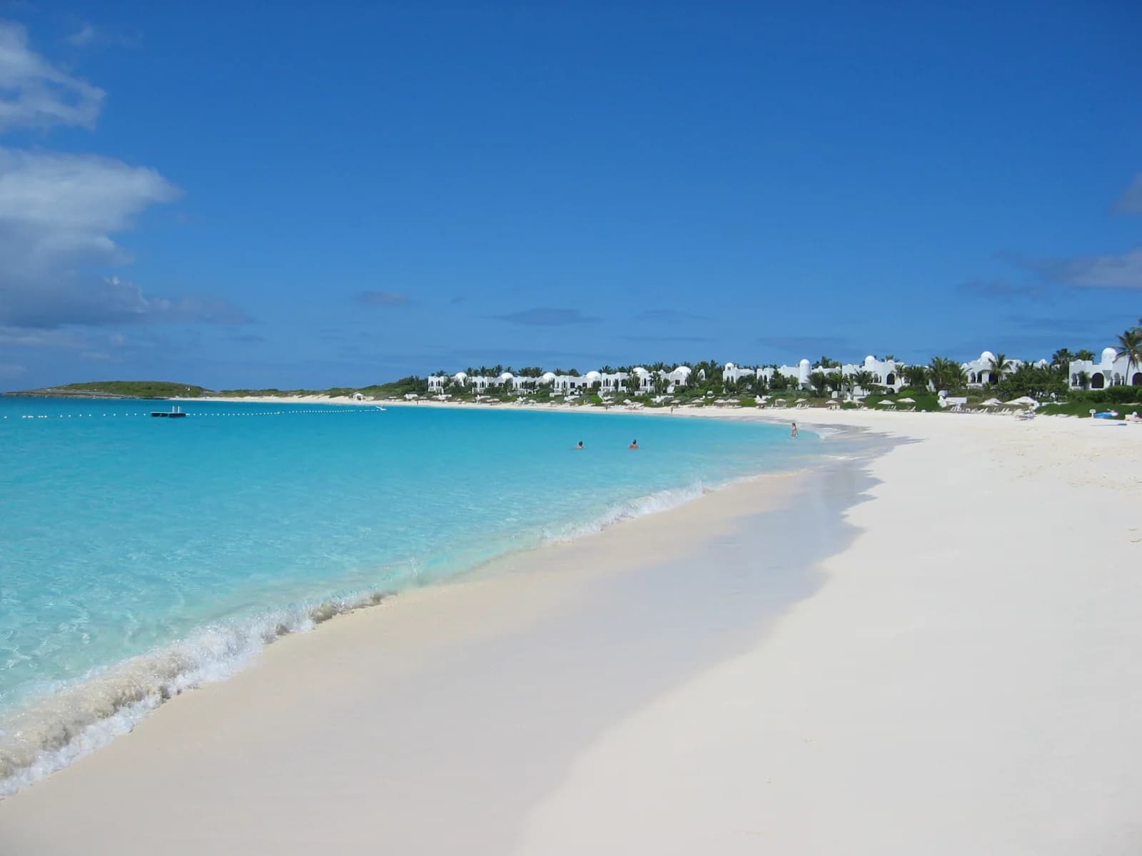 Curving white-sand beach and turquoise water at Maundays Bay in Anguilla