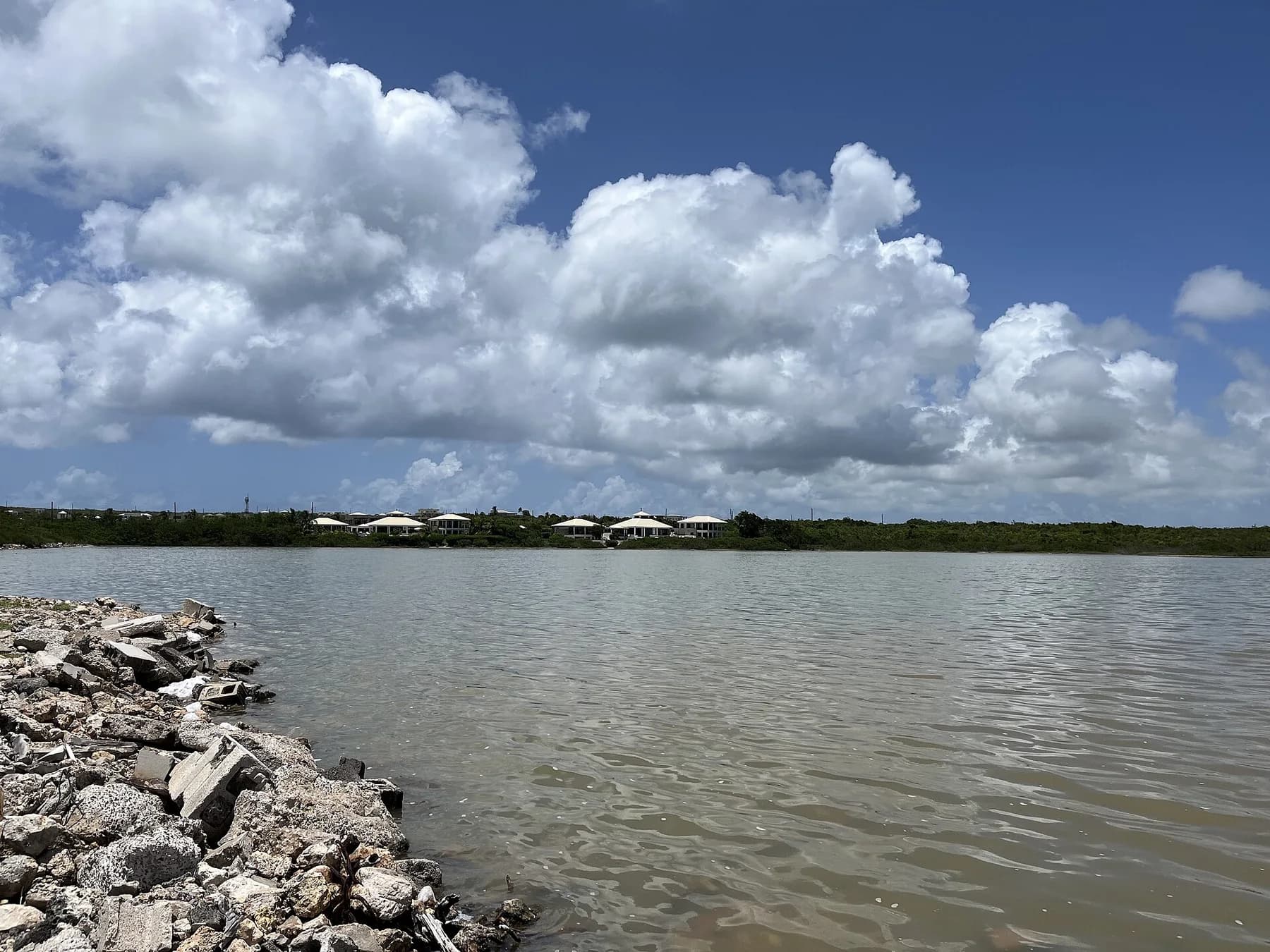 Rendezvous Bay Salt Pond beneath large clouds in Anguilla