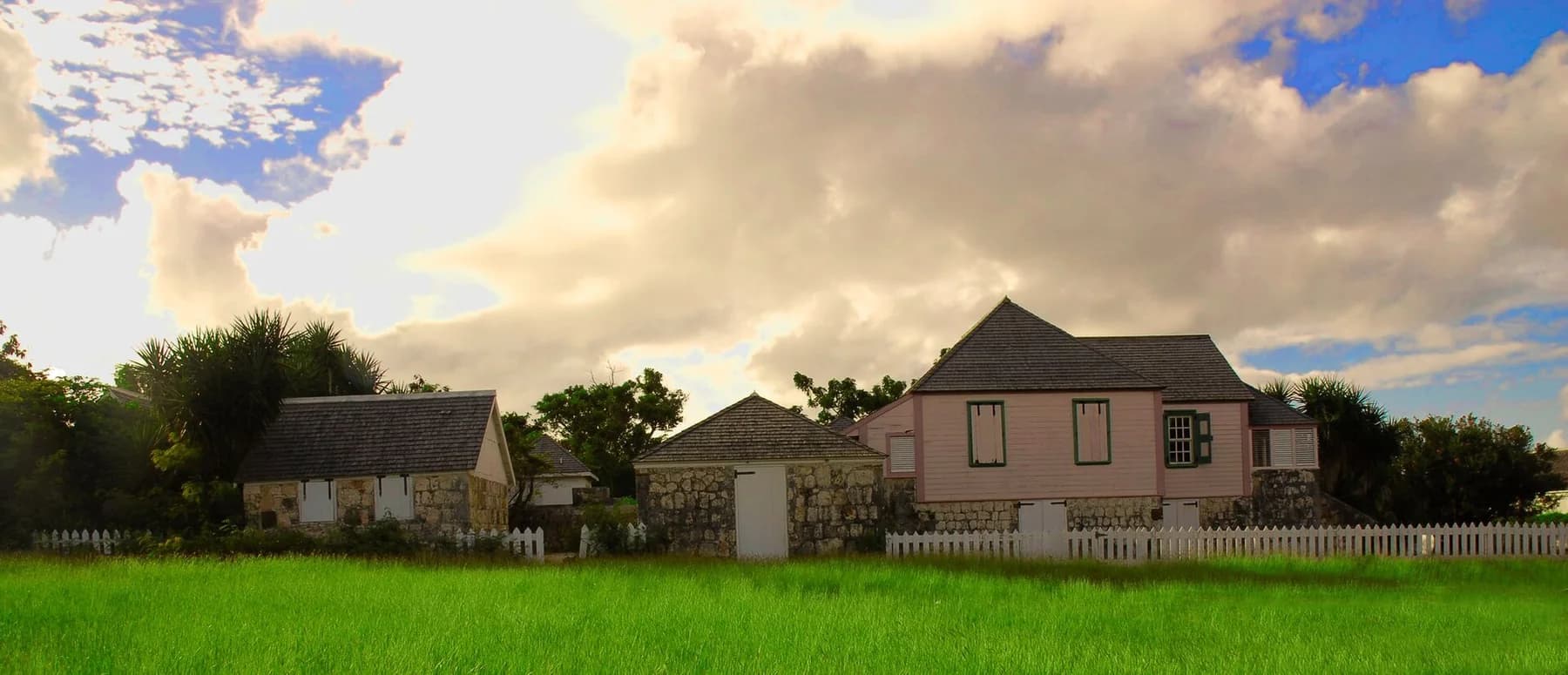 Historic stone outbuildings and the main house at Wallblake House in The Valley, Anguilla