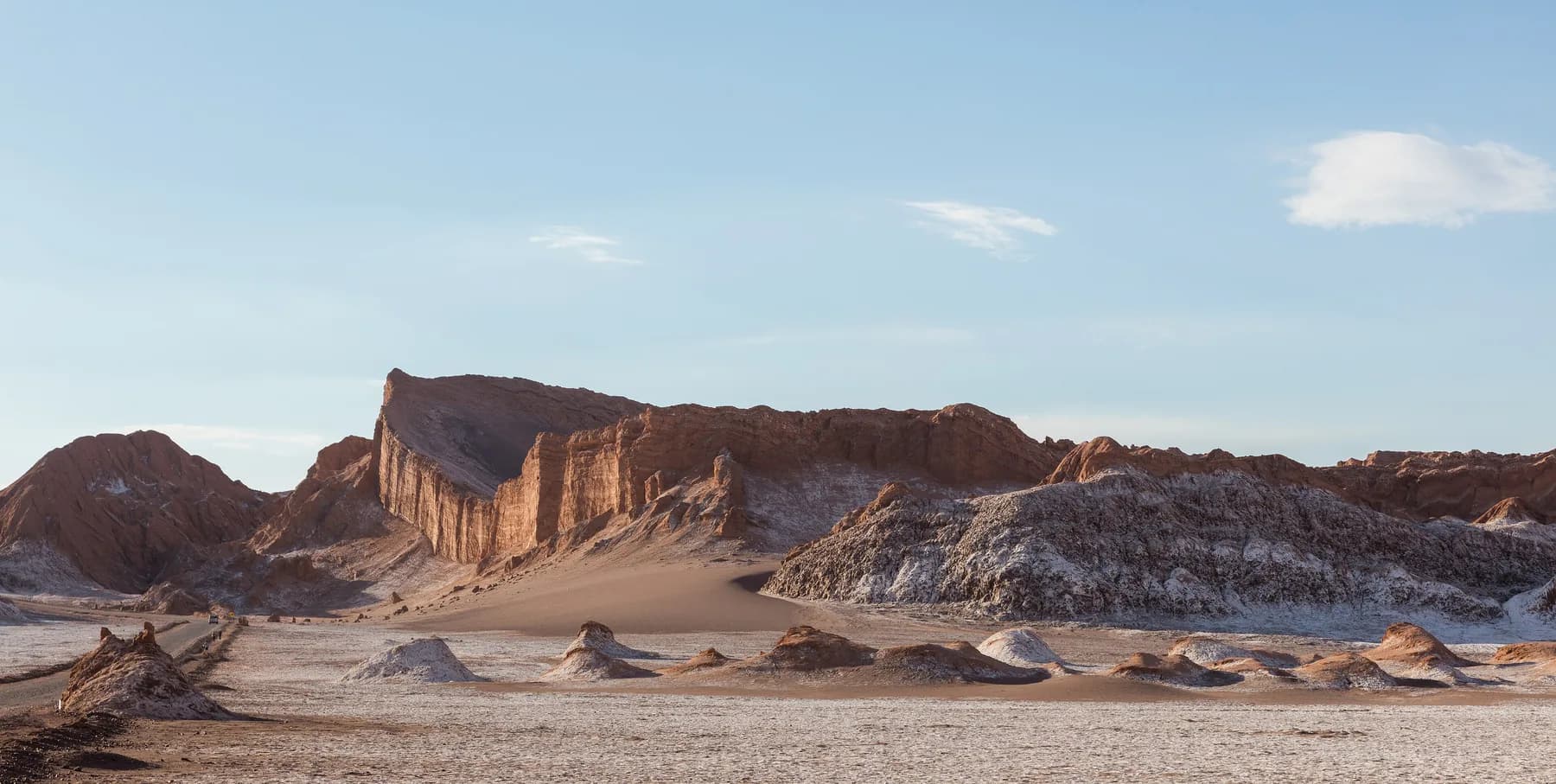 Golden light across the eroded Amphitheater formation in Moon Valley near San Pedro de Atacama