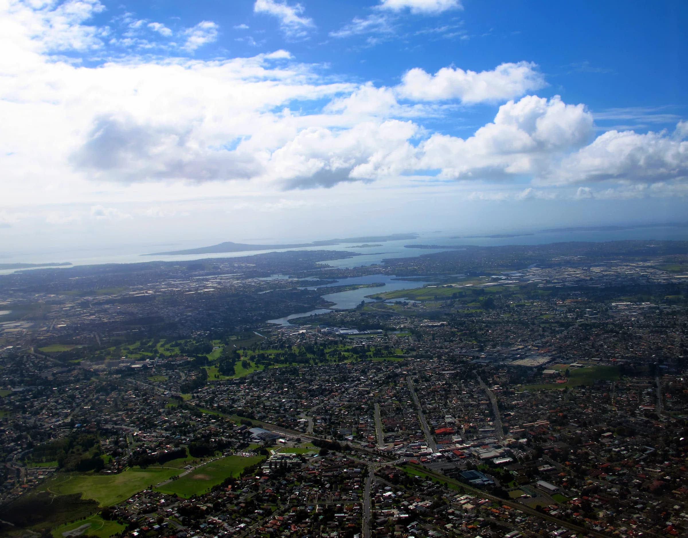 Aerial view of Auckland and Rangitoto across the Tāmaki River area