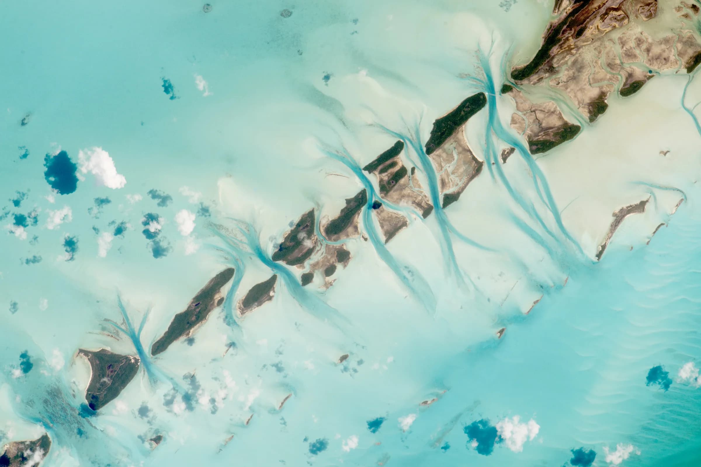 Aerial view of turquoise water, sandbars, and cays around Great Exuma Island in the Bahamas