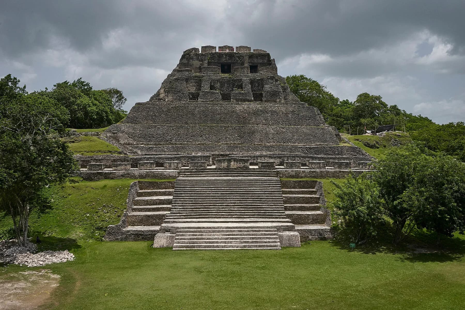 El Castillo rising above the green grounds at Xunantunich in Belize