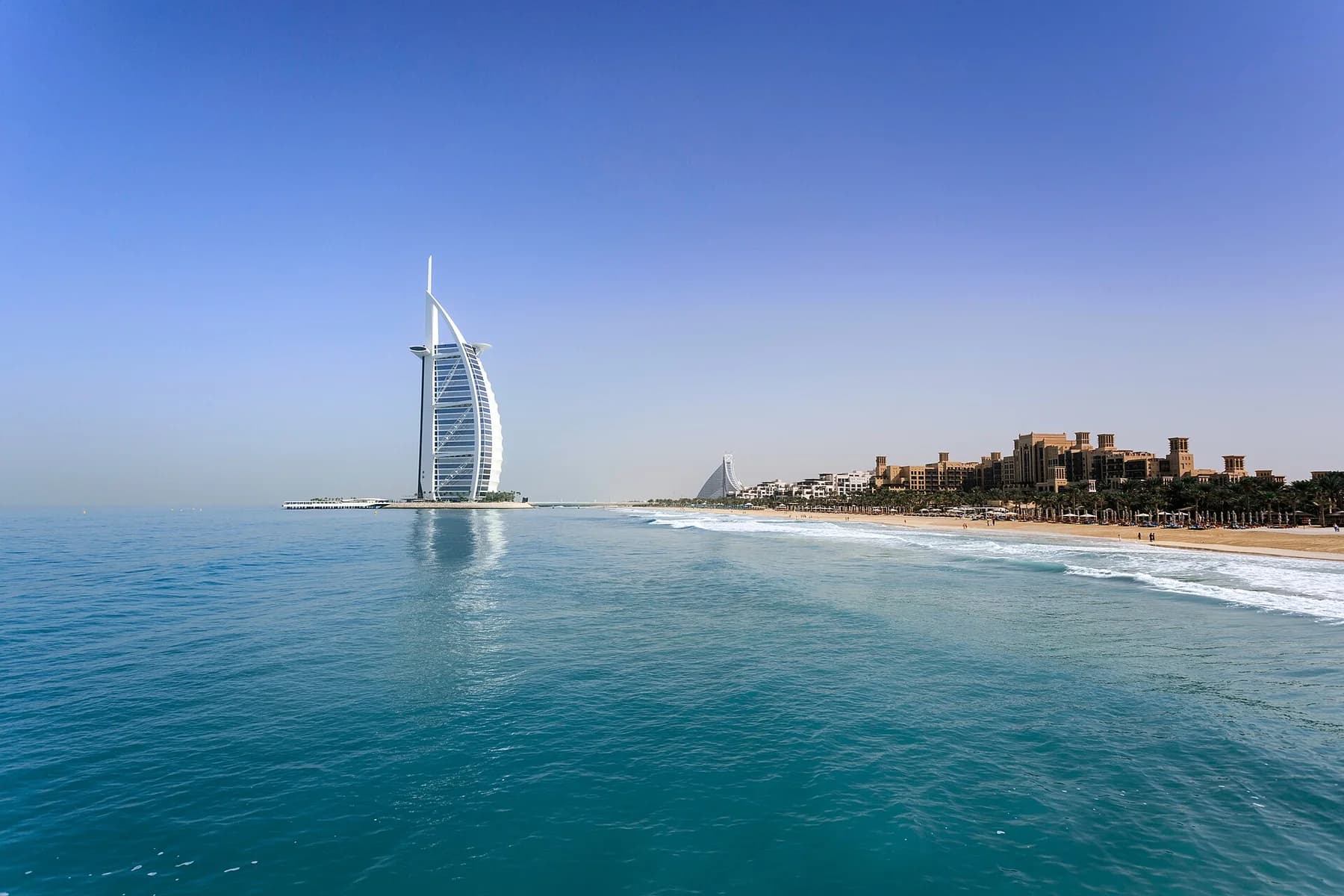 Burj Al Arab hotel seen across the water from Jumeirah Beach