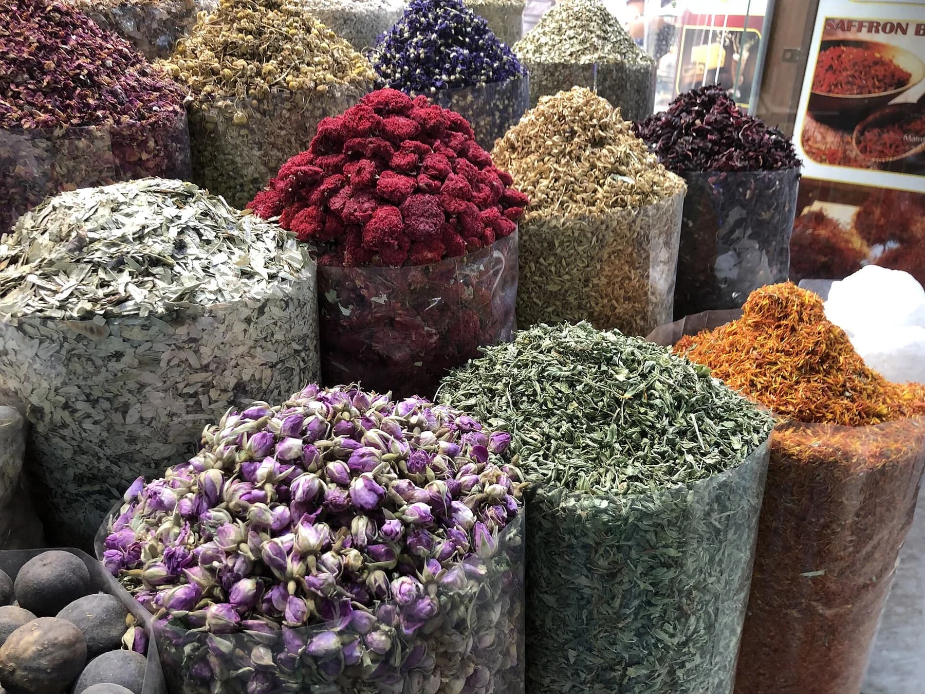 Colorful dried flowers, herbs, and spices displayed at Dubai Spice Souk