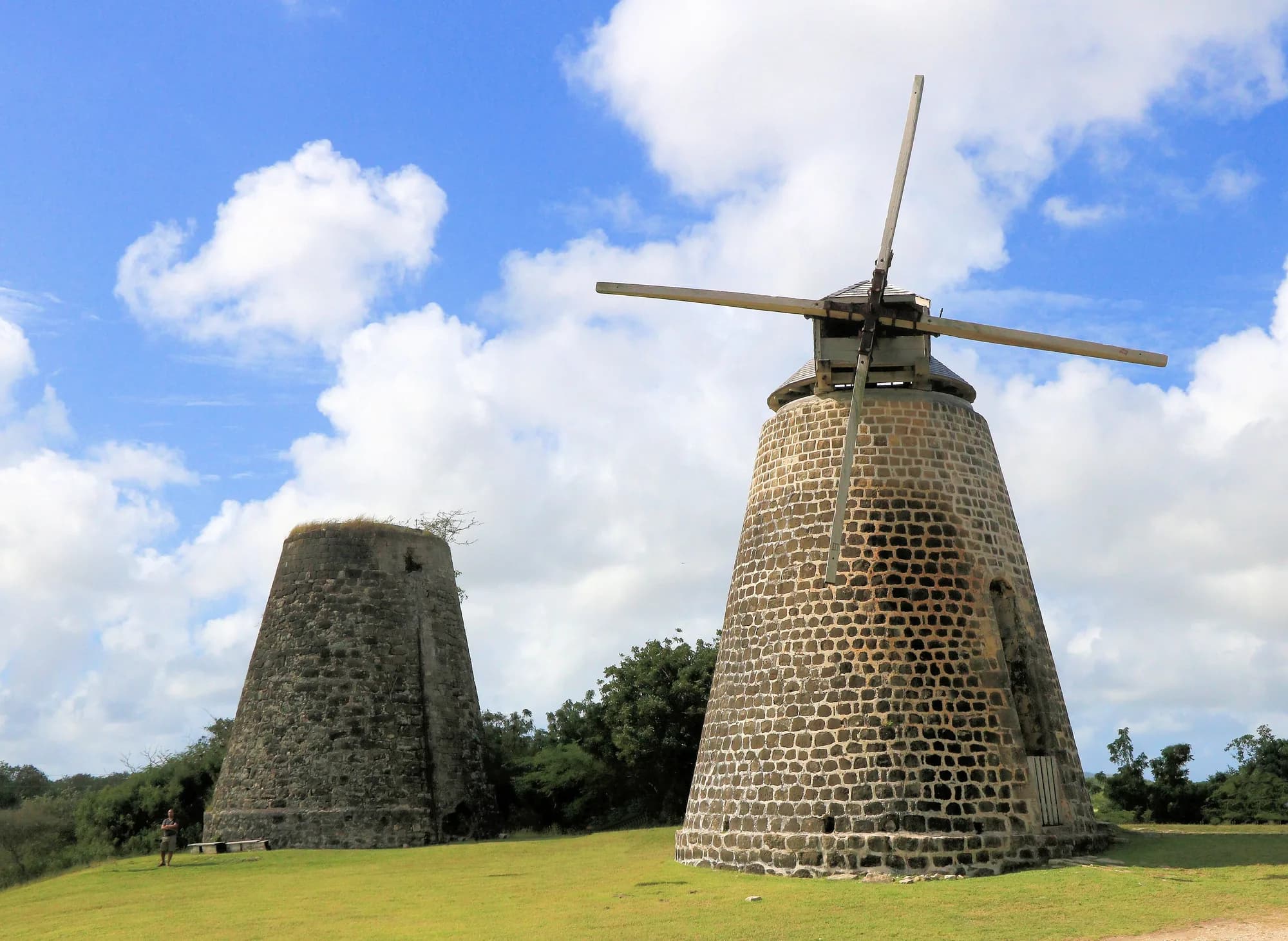 Restored stone sugar mill with sails and a second mill tower at Betty's Hope in Antigua