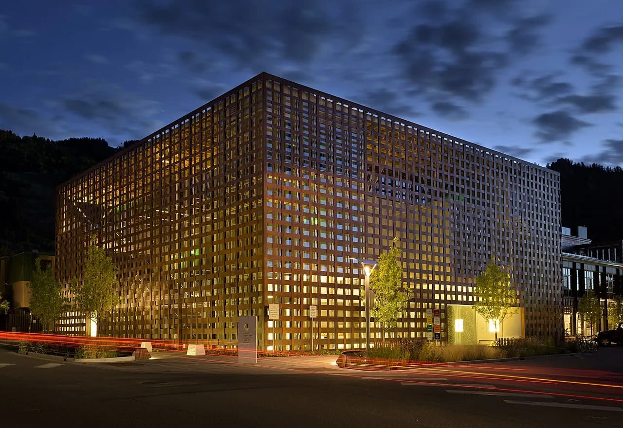 Illuminated woven facade of the Aspen Art Museum at dusk