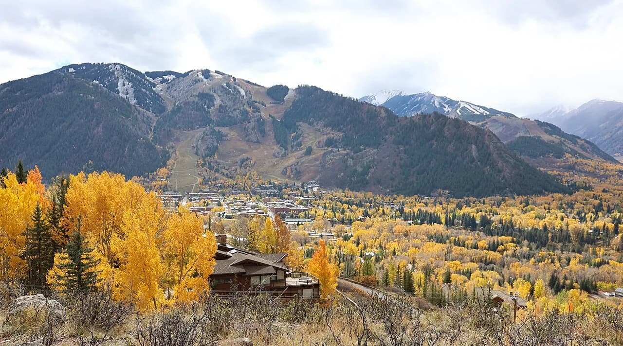 Aspen, Colorado, surrounded by golden fall foliage below Aspen Mountain